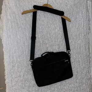 incase Bag: Black, Multiple Pockets, Adjustable & Removable Strap